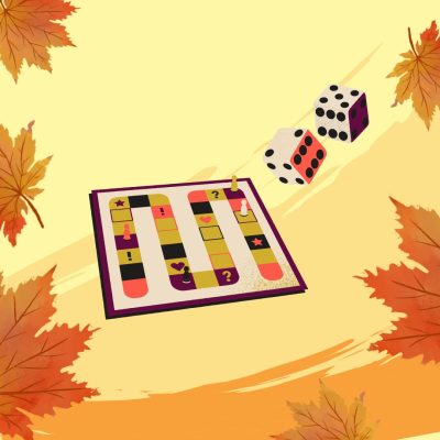 Reunoilla syksyn lehtiä ja keskellä pelilauta sekä kaksi noppaa.