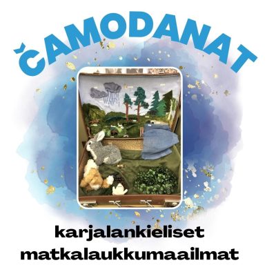 Avoin matkalaukku, jossa  pienoismaailma.